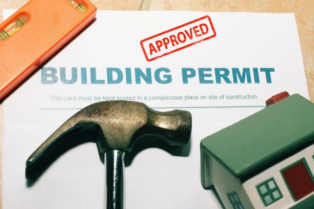 istock Building Permit concept with approved text on a residential home . 1488549821
