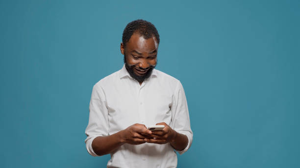 istock Millennial worker using social media app to text messages 1488550182