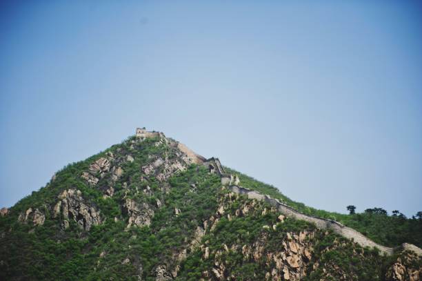 istock the side of a hill, with a mountain and trees on it 1488553141