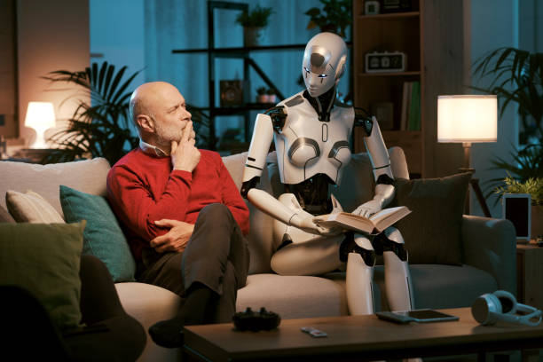 istock Senior man and android robot reading a book together 1488554553
