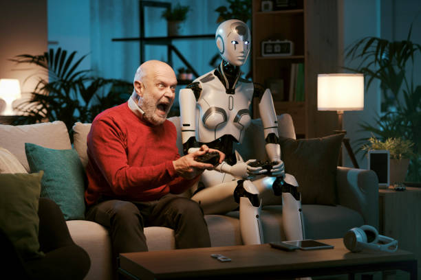 istock Senior man and humanoid robot playing video games together 1488554664