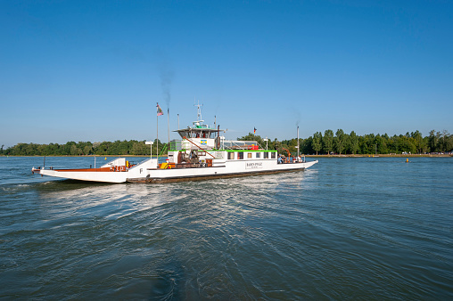 Neuburg am Rhein, Germany - July 24, 2021: Rhine ferry crossing the Rhine near Neuburg am Rhein. Region Palatinate in the federal state of Rhineland-Palatinate in Germany