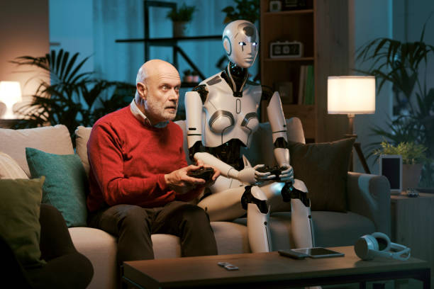 istock Senior man and humanoid robot playing video games together 1488555438