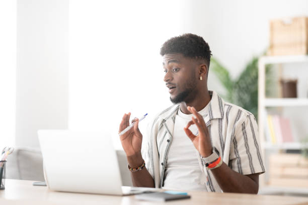 istock African american man having video call. 1488555935