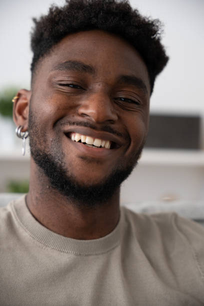 istock Portrait of black man looking and smiling at camera 1488555981