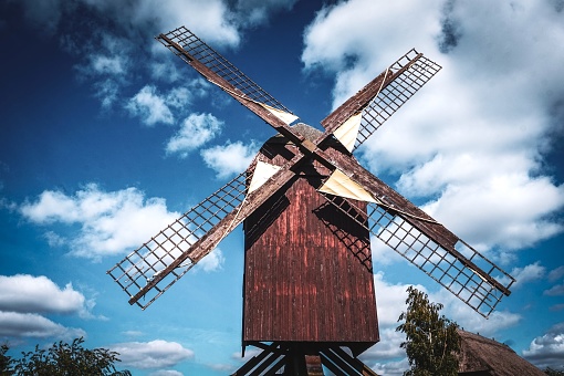 A traditional windmill from Öland, which is an island in the Baltic Sea. These windmills were used to grind flour from wheat grains. This windmill is painted in the typical red color that adorns many older buildings in Sweden.