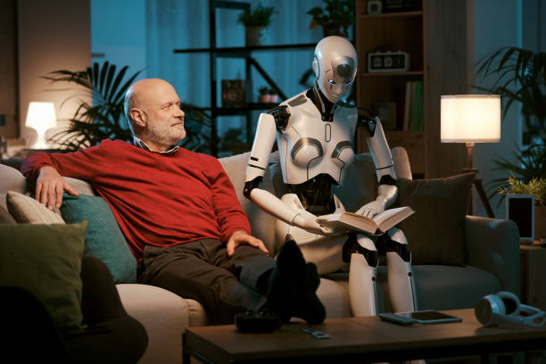 istock Senior man and android robot reading a book together 1488556337