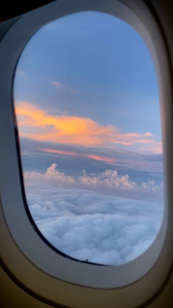 istock Sunset Sky View from an Airplane Window 1488557117