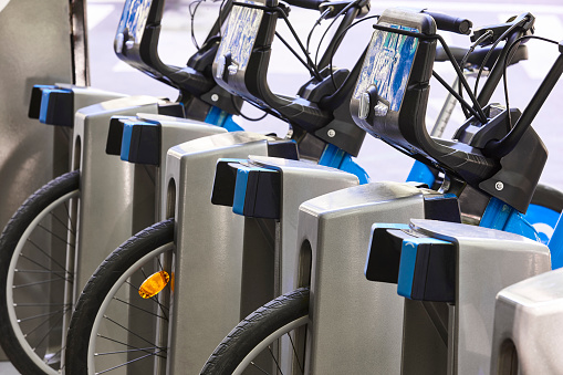 Charging urban electric battery bikes in the city. Eco transport