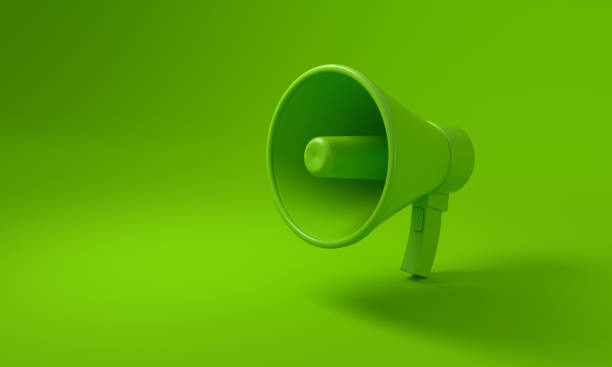 Megaphone on green background, Sustainability concept.