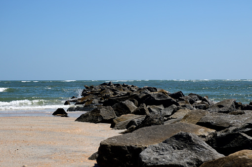 Jetty rocks by the ocean inlet  Vilano Beach, Florida.
