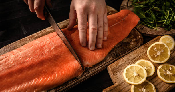istock Chief hands preparing salmon fillet 1488564718
