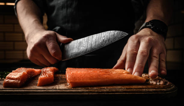 istock Chief hands preparing salmon fillet 1488564762