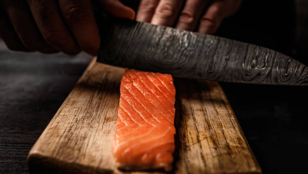 istock Chief hands preparing salmon fillet 1488564777