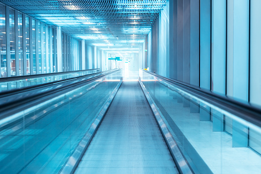 Blue toned airport corridor