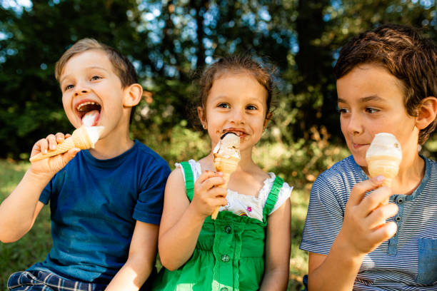 istock Children eating ice cream in the park 1488566457