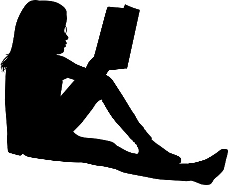 Silhouette of a sitting girl with a book.