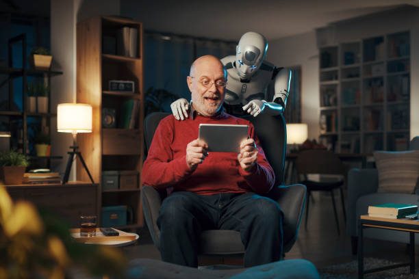 istock Senior man and humanoid robot watching videos together 1488569007