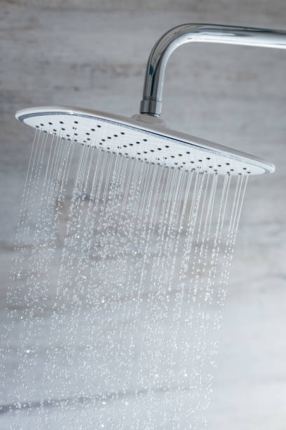 istock Close up running water from shower in modern bathroom 1488572255