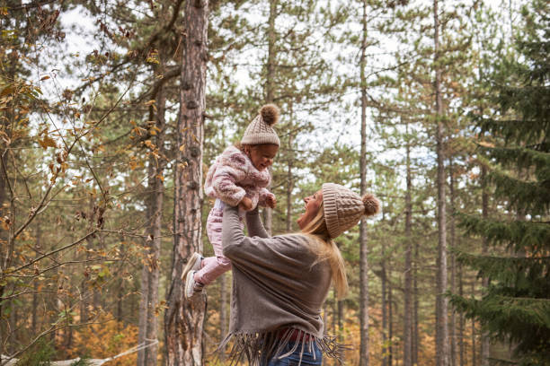 istock Mother and daughter having fun in nature 1488573456