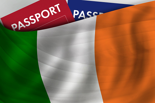 Irish flag background and passport of Ireland. Citizenship, official legal immigration, visa, business and travel concept.