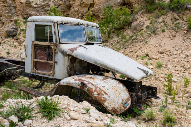 istock An old rusty truck in an abandoned quarry. 1488575615