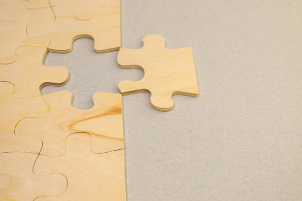 istock Jigsaw puzzle with missing piece. Missing puzzle pieces. Concept image of unfinished task. 1488576215