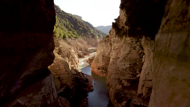 Flight in the canyon over the bed of a dried-up river