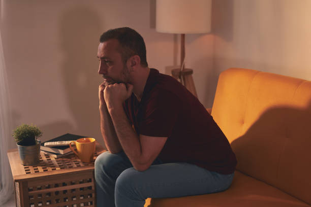 istock Bored man with lethargy and apathy sitting at home alone. 1488577718
