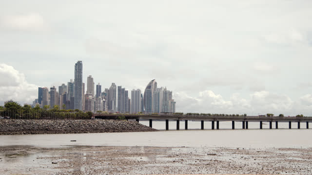 Low Tide in the Foreground of New Panama City, Panama Skyline from Las Bóvedas Park on an Overcast Day