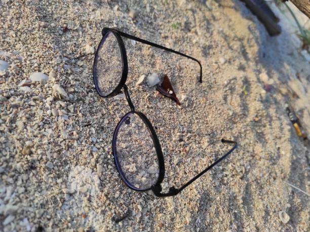 istock glasses on the sand 1488582451