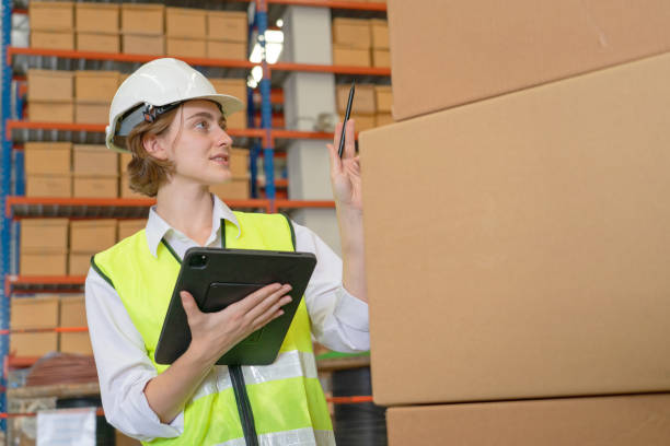 istock A female manager is checking inventory inside a warehouse. 1488590137