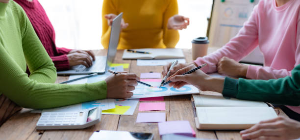 istock Business people meeting explaining the financial graph data and marketing plan. Group of business people at meeting assessment the state of business investment and marketing. 1488591593