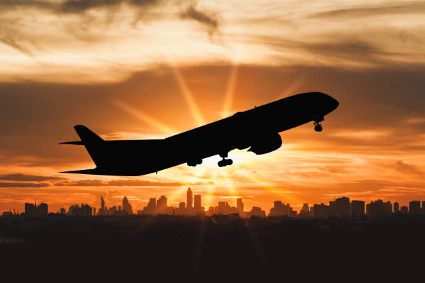 istock silhouette of commercial plane flying . 1488596243