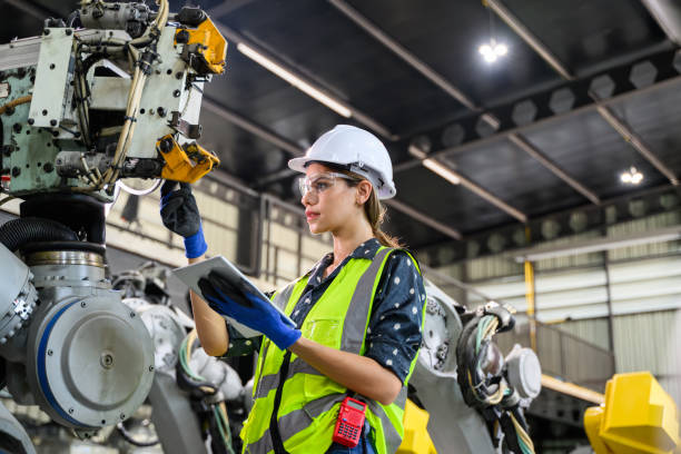 istock Female business owner engineer managing and checking work at factory 1488598306
