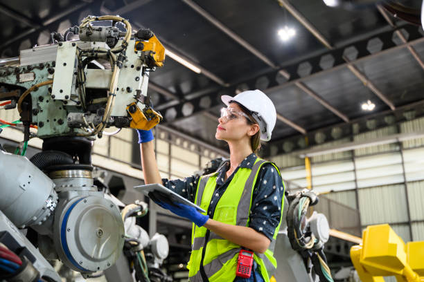 istock Female business owner engineer managing and checking work at factory 1488598535
