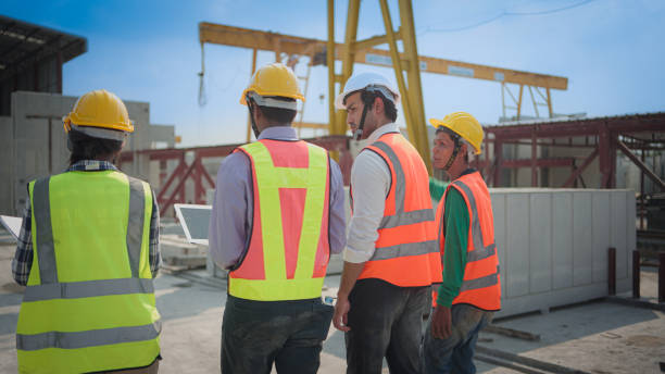 istock Back view of Asian civil engineer or Architect, inspector with contractor,.foreman or worker 1488599874