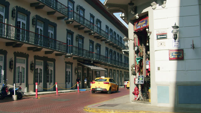 Yellow Taxi Cabs Passing in Panama City, Panama in the Touristic 