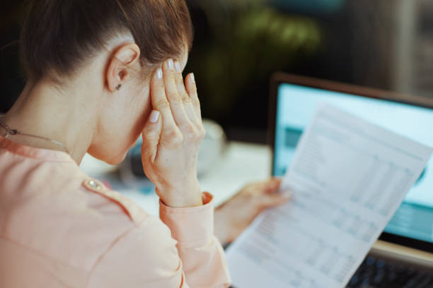 istock Seen from behind modern business woman having headache 1488604270