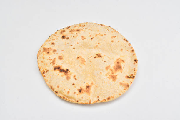 istock Tawa roti isolated on white background, indian wheat chapati 1488607342