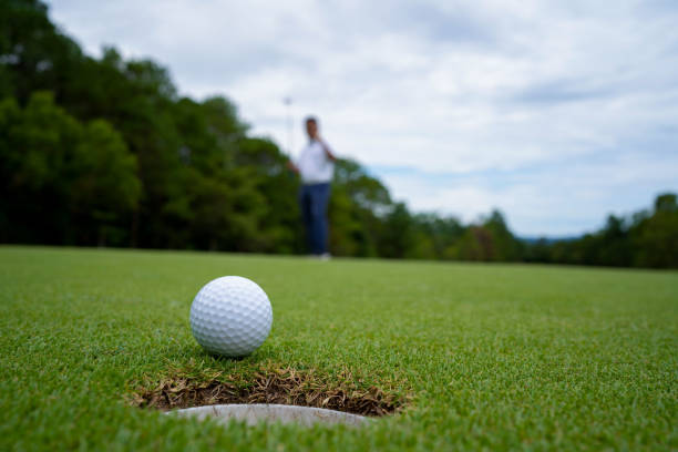 istock Blurred golfer playing golf in the evening golf course, on sun set evening time. 1488607803