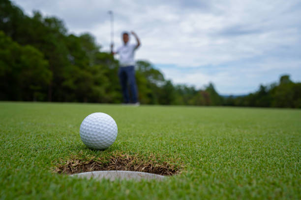 istock Blurred golfer playing golf in the evening golf course, on sun set evening time. 1488607806