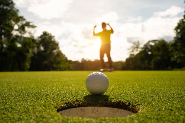 istock Blurred golfer playing golf in the evening golf course, on sun set evening time. 1488608431