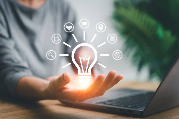 istock Creative idea concept with education and business development , Women holding creative light bulb icon in hand with business icon educational development creativity and innovative are keys to success 1488608537