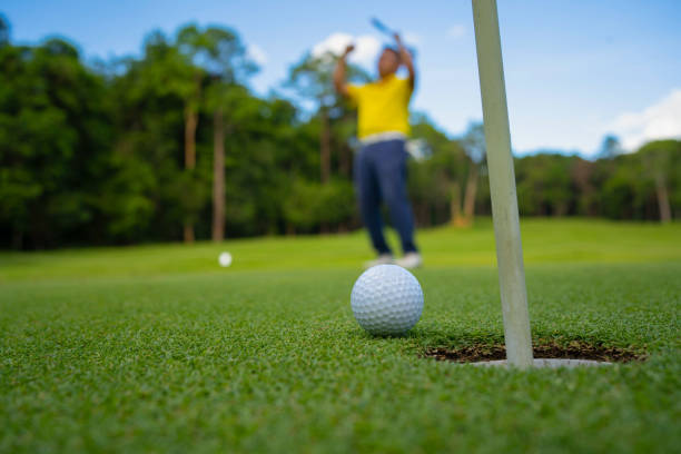 istock Blurred golfer playing golf in the evening golf course, on sun set evening time. 1488608542