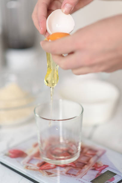 istock A woman separates egg yolks and whites for culinary and baking purposes 1488609152