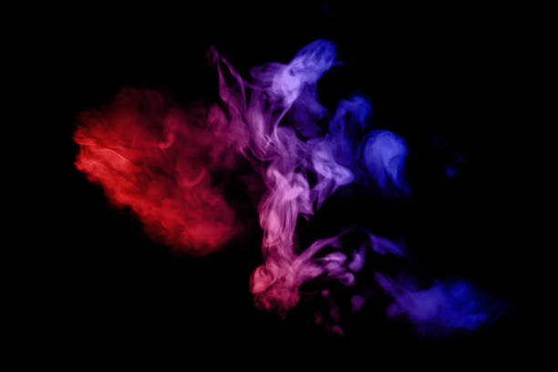 istock Artificial smoke in red-blue light on black background in darkness. 1488611491