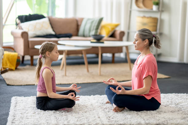 istock Mother and Daughter Meditation 1488612401