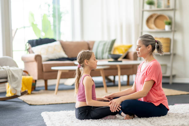 istock Mother and Daughter Meditation 1488612451