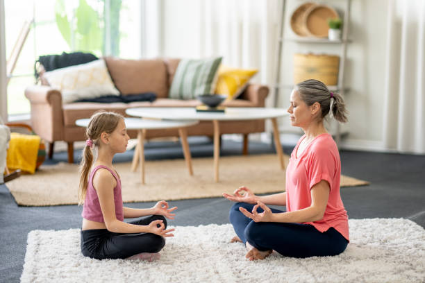 istock Mother and Daughter Meditation 1488612472
